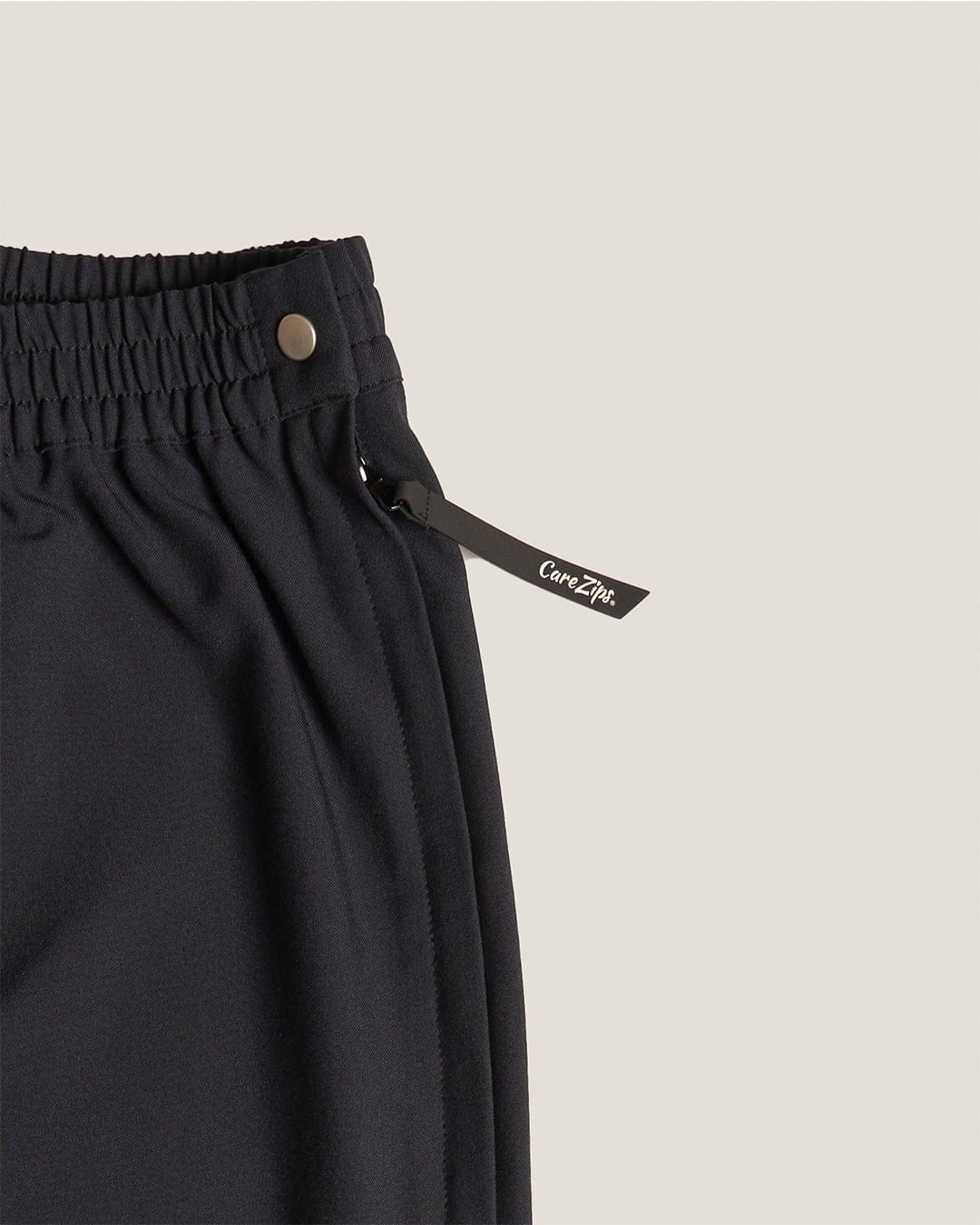 CareZips® Men's Adaptive Pants by Joe & Bella | Close-Up Of Extra Long Zipper Pull and Side Snap