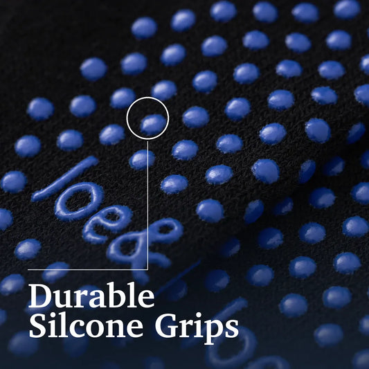 Black socks with blue patterns and 'Joe Bats' branding on a neutral background #Black