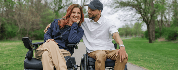 a man and a woman in wheelchairs wearing Joe & Bella adaptive clothes