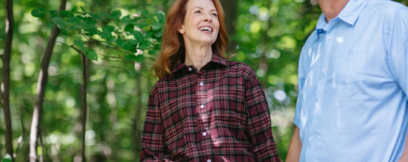 woman wearing a red flannel shirt with hidden magnetic buttons