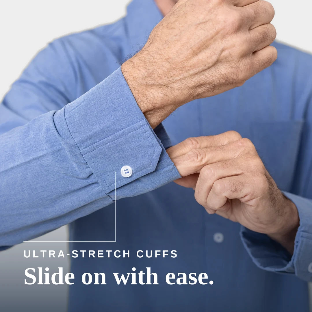 Close-up of a person wearing a blue long-sleeve dress shirt and stretching the cuff with one hand while pulling the buttoned cuff with the other. White text at the bottom reads 'ULTRA-STRETCH CUFFS Slide on with ease. Joe & Bella Everyday Magnetic Button-Down for Men | Tailored-Fit #Heathered Blue