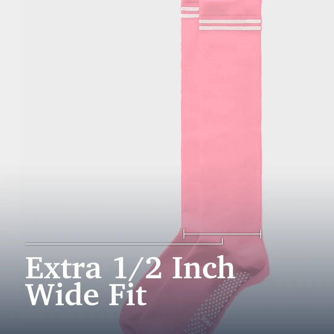["A single pink wide-fit sock shown vertically on a light gray gradient background with text reading 'Extra 1/2 Inch Wide Fit' and measurement lines indicating the width. Joe & Bella Big-Grip No-Slip Compression Socks: 3-Pack ", "Pink"]