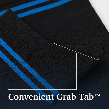 Close-up of a black knit sock with bright blue stripes, showing a folded cuff and overlaid text reading 'Convenient Grab Tab' with a white measurement line indicating the tab size. Joe & Bella Big-Grip No-Slip Compression Socks: 3-Pack #Black