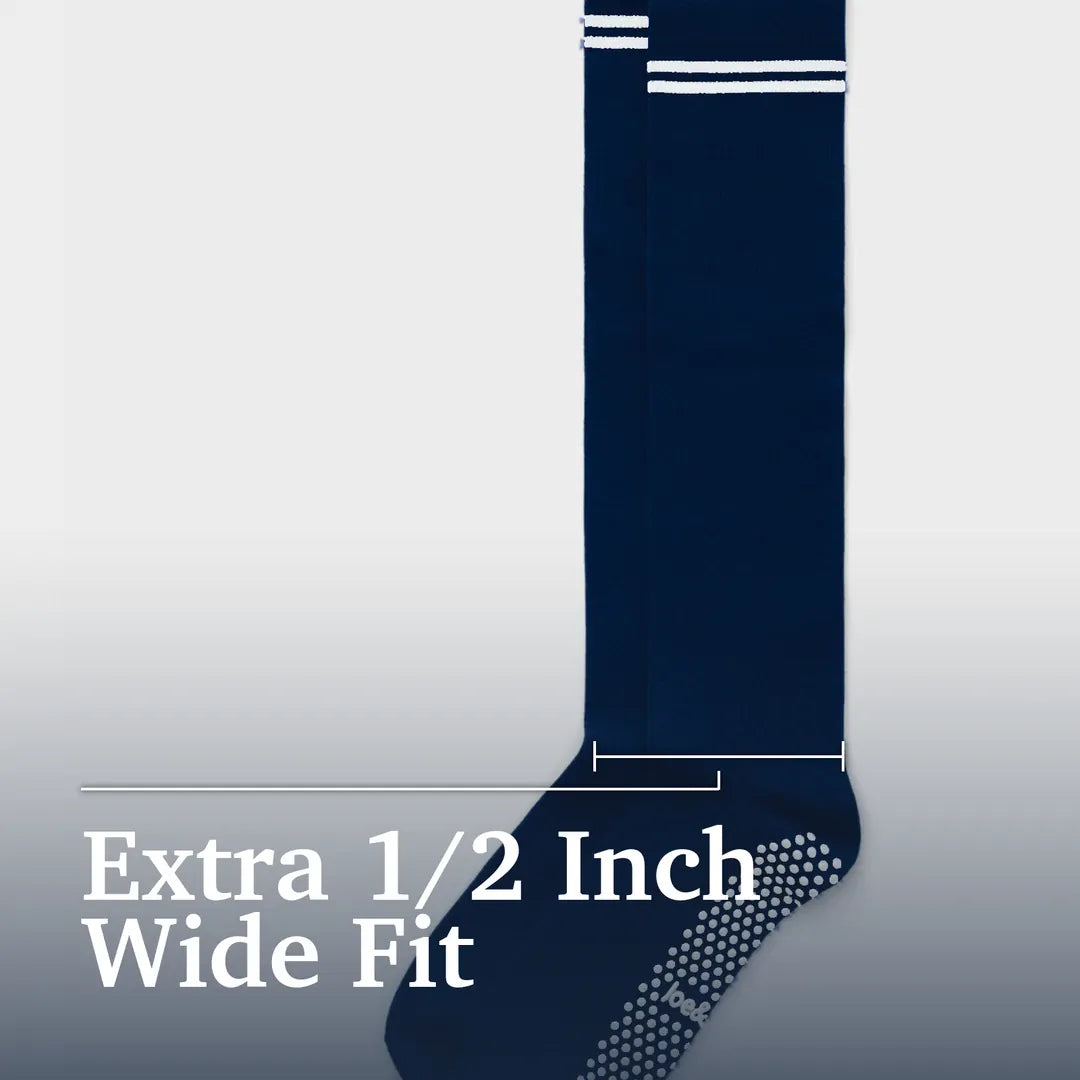 A single navy blue wide-fit sock shown against a light gray gradient background with white text reading 'Extra 1/2 Inch Wide Fit' and a measurement guide indicating the width. Joe & Bella Pink / REG Big-Grip No-Slip Compression Socks: 3-Pack #Dark Navy