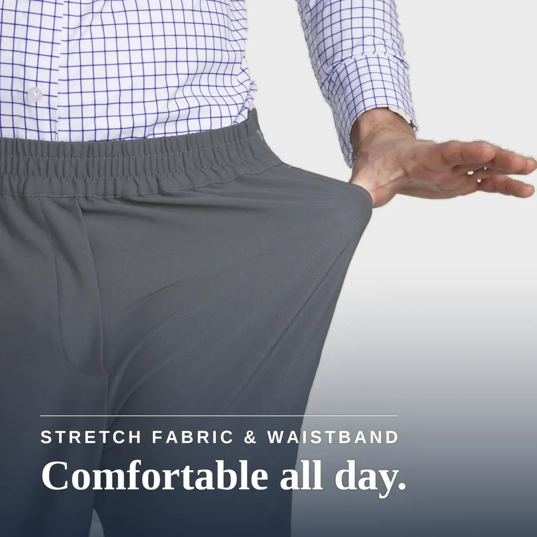 ["A close-up of a person wearing gray elastic-waist pants, pulling the fabric outward with one hand to demonstrate stretch. The person is also wearing a blue and white checkered shirt. Joe & Bella CareZips® Men's Access Pants ", "Slate Grey"]