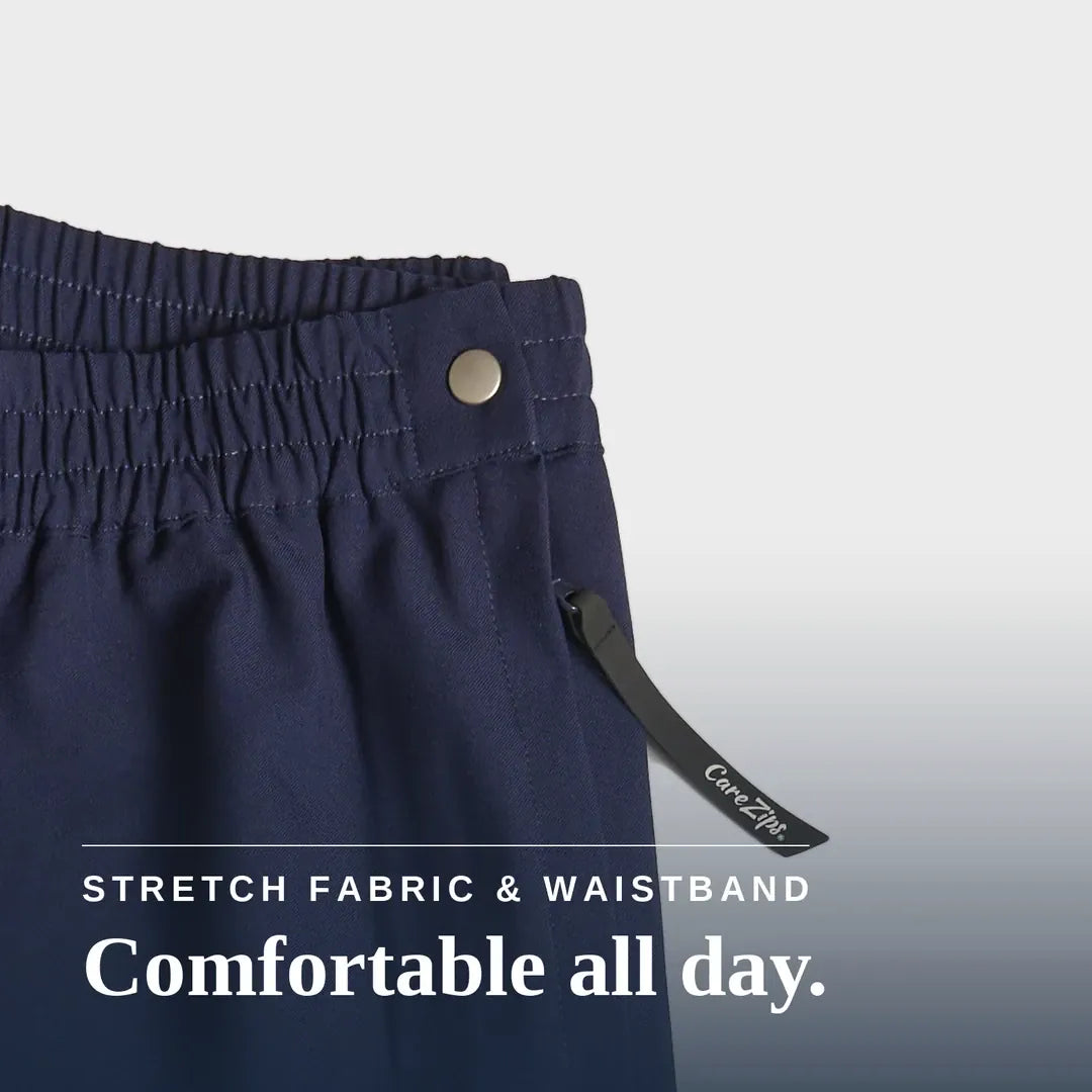 Close-up of navy blue pants showing the elastic waistband with a metal button, a drawstring detail, and text overlay that reads 'STRETCH FABRIC & WAISTBAND Comfortable all day.'. Joe & Bella CareZips® Women's Access Pants #Navy