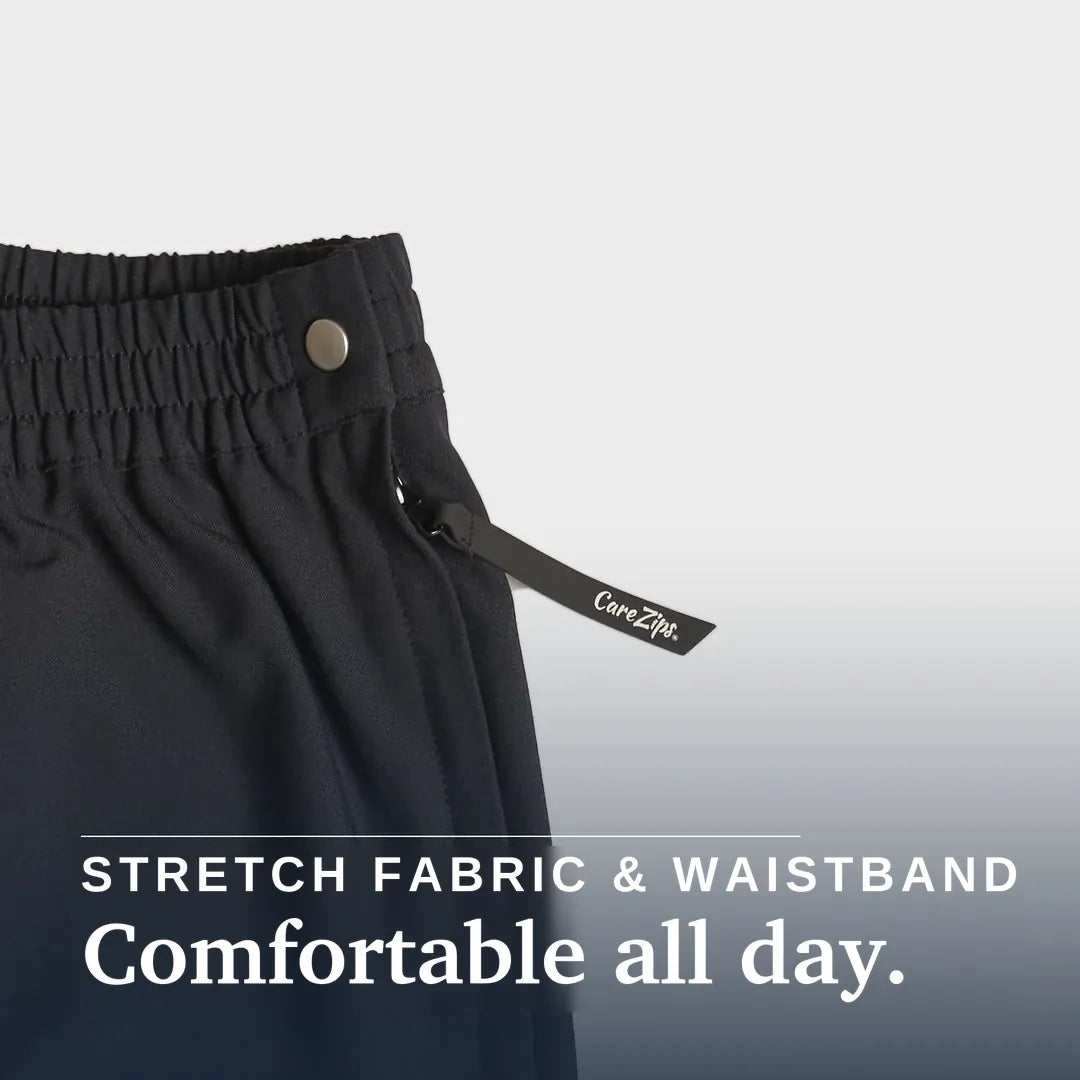 ["Close-up of dark charcoal gray or black athletic pants showing the elastic waistband, a metal snap button, and a drawstring with a visible CareZip tag. Text overlay at the bottom reads 'STRETCH FABRIC & WAISTBAND Comfortable all day. Joe & Bella Black / XS CareZips® Women's Adaptive Pants ", "Black"]