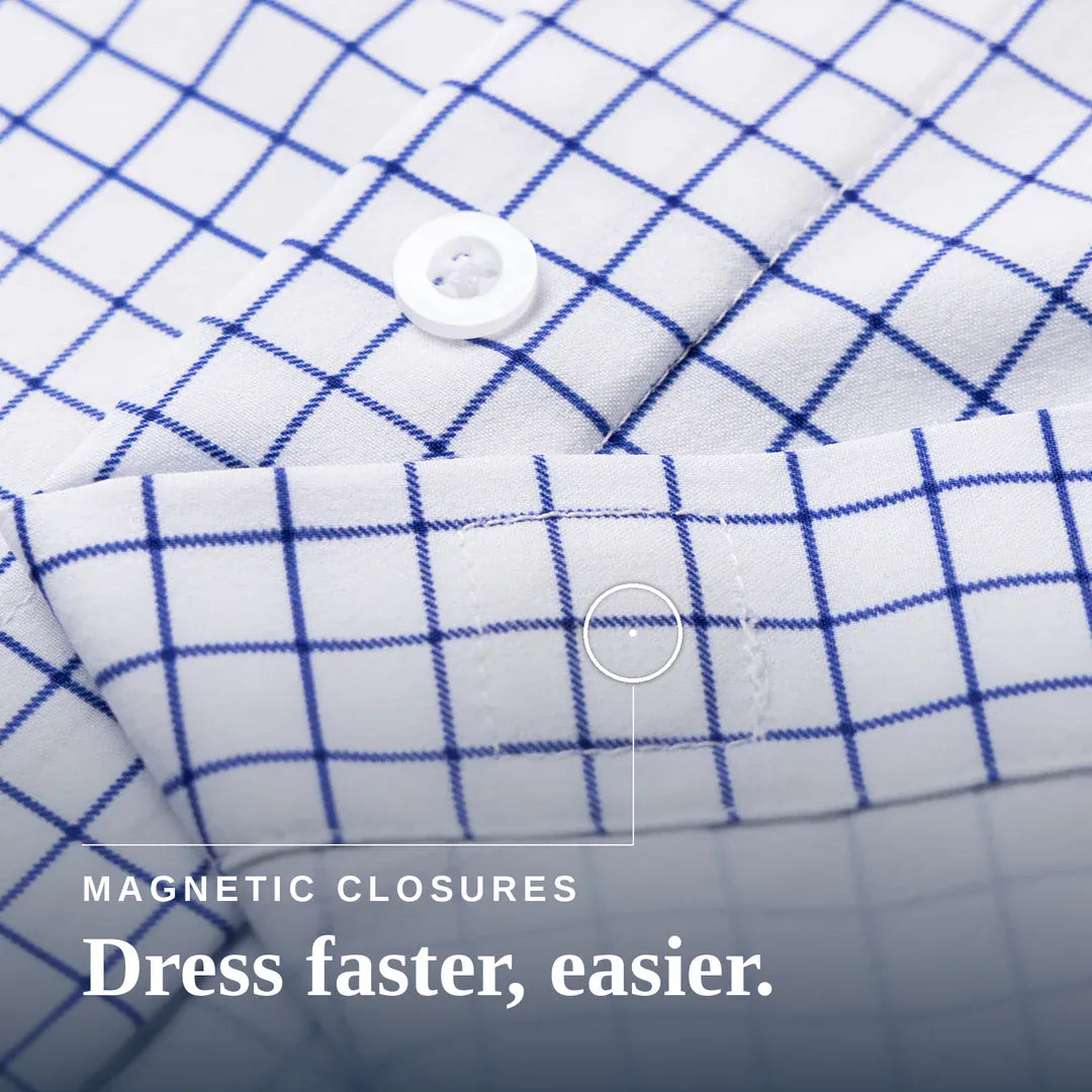 Close-up of a white fabric garment with a blue grid pattern, showing a button closure and text reading 'MAGNETIC CLOSURES Dress faster, easier.'. Joe & Bella Everyday Magnetic Button-Down for Men | Tailored-Fit #White Check
