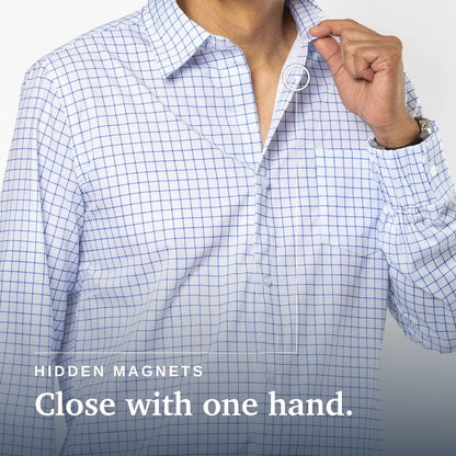 Close-up of a person wearing a white button-up shirt with a blue grid pattern, opening the collar with one hand. White text at the bottom reads 'HIDDEN MAGNETS Close with one hand. Joe & Bella Everyday Magnetic Button-Down for Men | Tailored-Fit #White Check