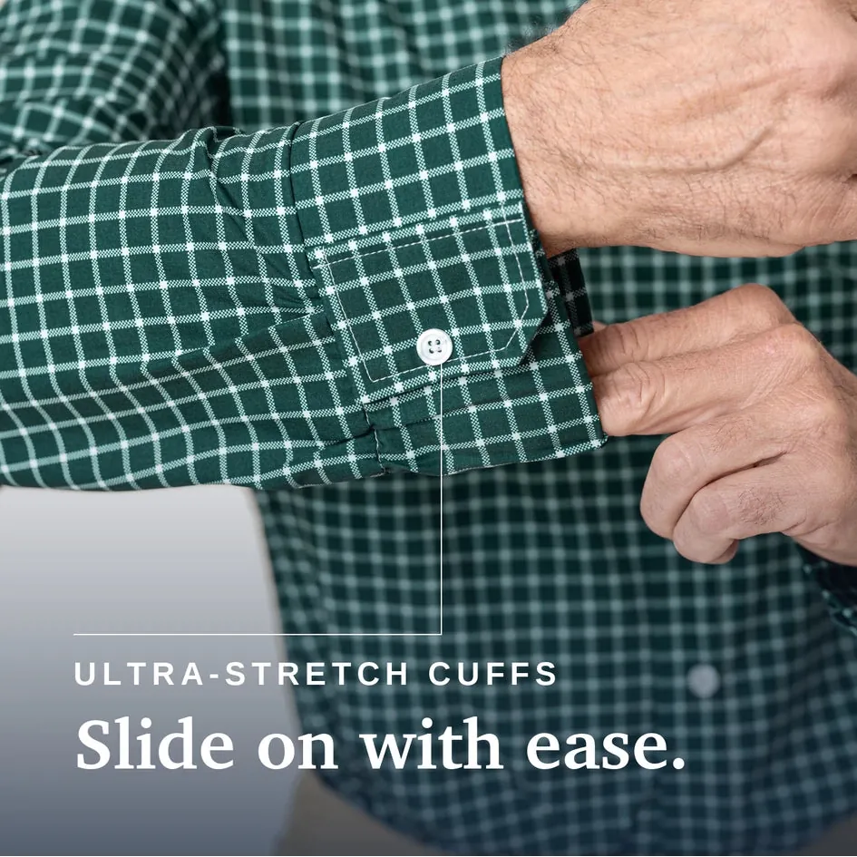 Close-up of a man's hands adjusting the cuff of a green and white checkered long-sleeve shirt, demonstrating the ultra-stretch cuff feature. White text at the bottom reads 'ULTRA-STRETCH CUFFS Slide on with ease. Joe & Bella Everyday Magnetic Button-Down for Men | Tailored-Fit#Green Check