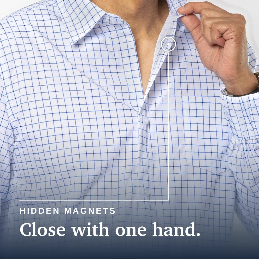 ["Close-up of a person wearing a white button-up shirt with a blue grid pattern, opening the collar with one hand. White text at the bottom reads 'HIDDEN MAGNETS Close with one hand. Joe & Bella Everyday Magnetic Button-Down for Men | Tailored-Fit ", "White Check"]
