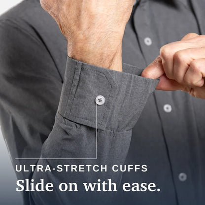 Close-up of a person's hands adjusting the cuff of a dark gray button-down shirt, with text reading 'ULTRA-STRETCH CUFFS Slide on with ease.'. Joe & Bella Everyday Magnetic Button-Down for Men | Tailored-Fit #Heathered Grey