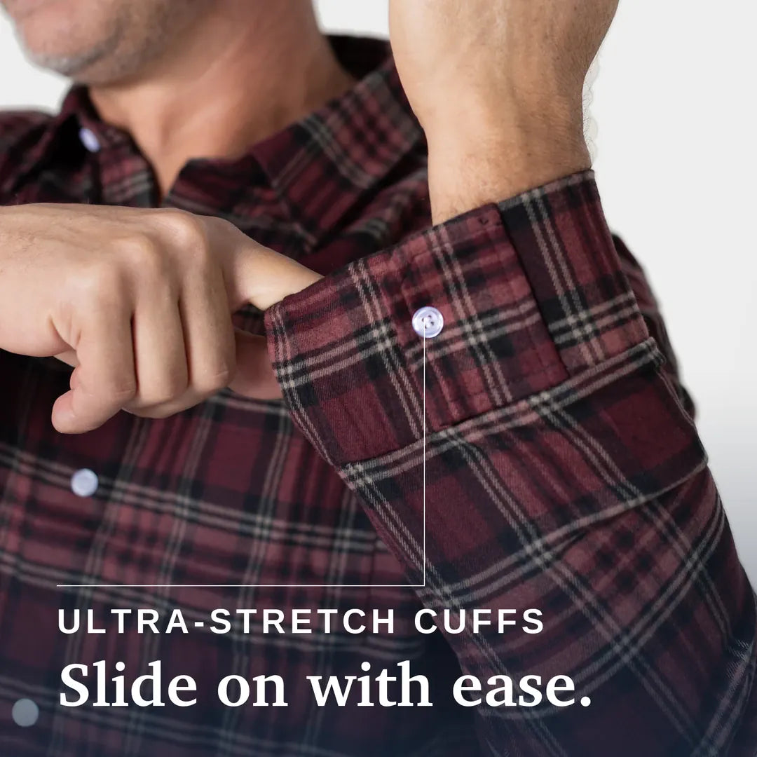 ["Close-up of a man wearing a red and black plaid button-up shirt, pulling the cuff outward to demonstrate stretch, with text reading 'ULTRA-STRETCH CUFFS Slide on with ease.'. Joe & Bella Red Plaid / S Everyday Magnetic Flannel for Men ", "Red Plaid"]