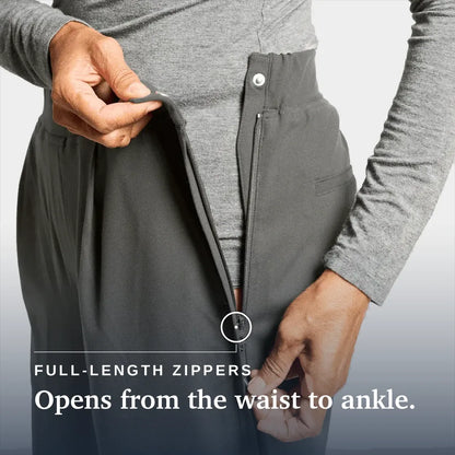 Close-up of a person wearing dark gray pants and a heather gray long-sleeve top, demonstrating a full-length zipper that opens from the waist to the ankle. White text at the bottom reads 'FULL-LENGTH ZIPPERS Opens from the waist to ankle. Joe & Bella Slate Grey / Everyday Side-Zip Pants for Women #Slate Grey