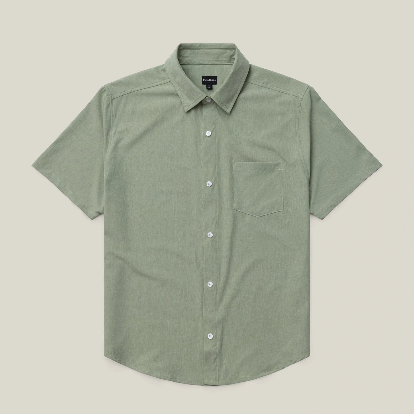 Green short-sleeve shirt on a beige background #green