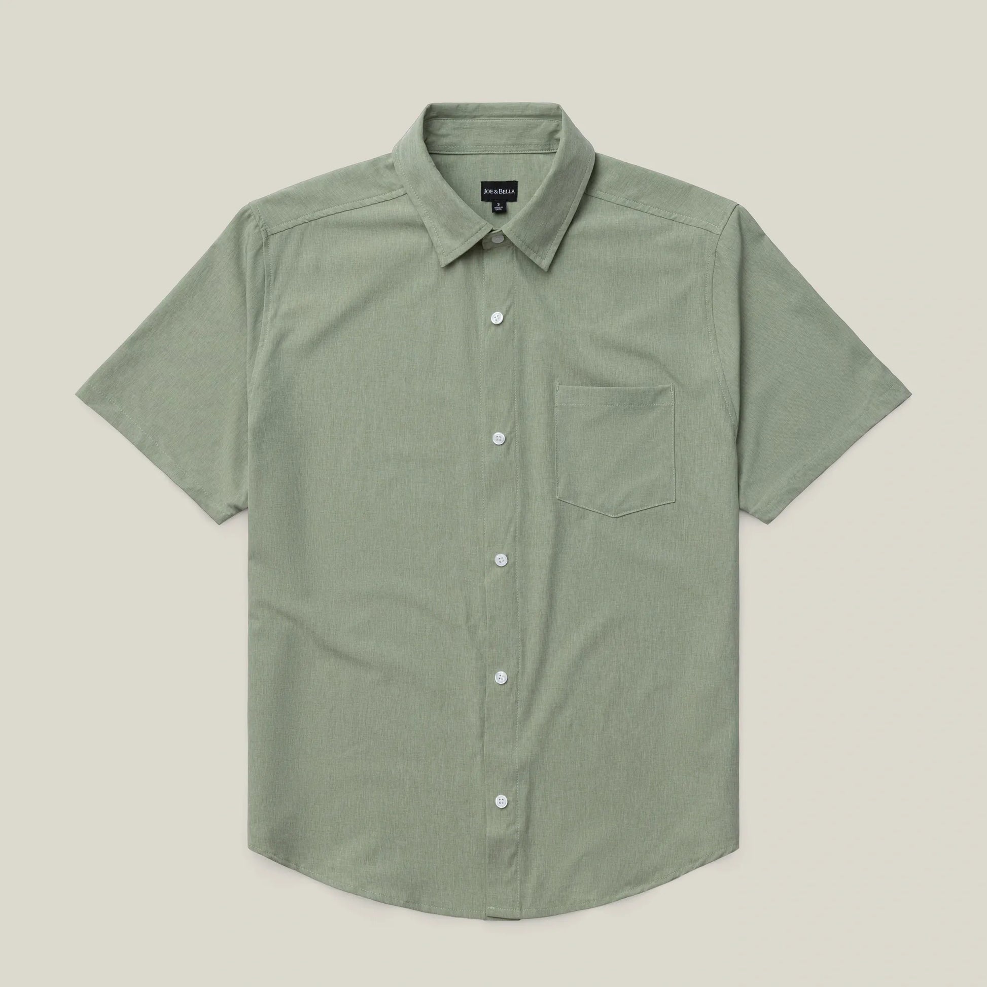 ["Green short-sleeve shirt on a beige background ", "green"]