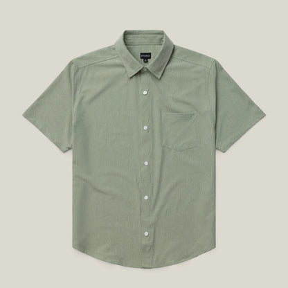 Green short-sleeve shirt on a beige background #green