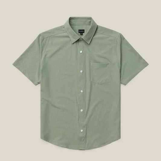 Green short-sleeve shirt on a beige background #green