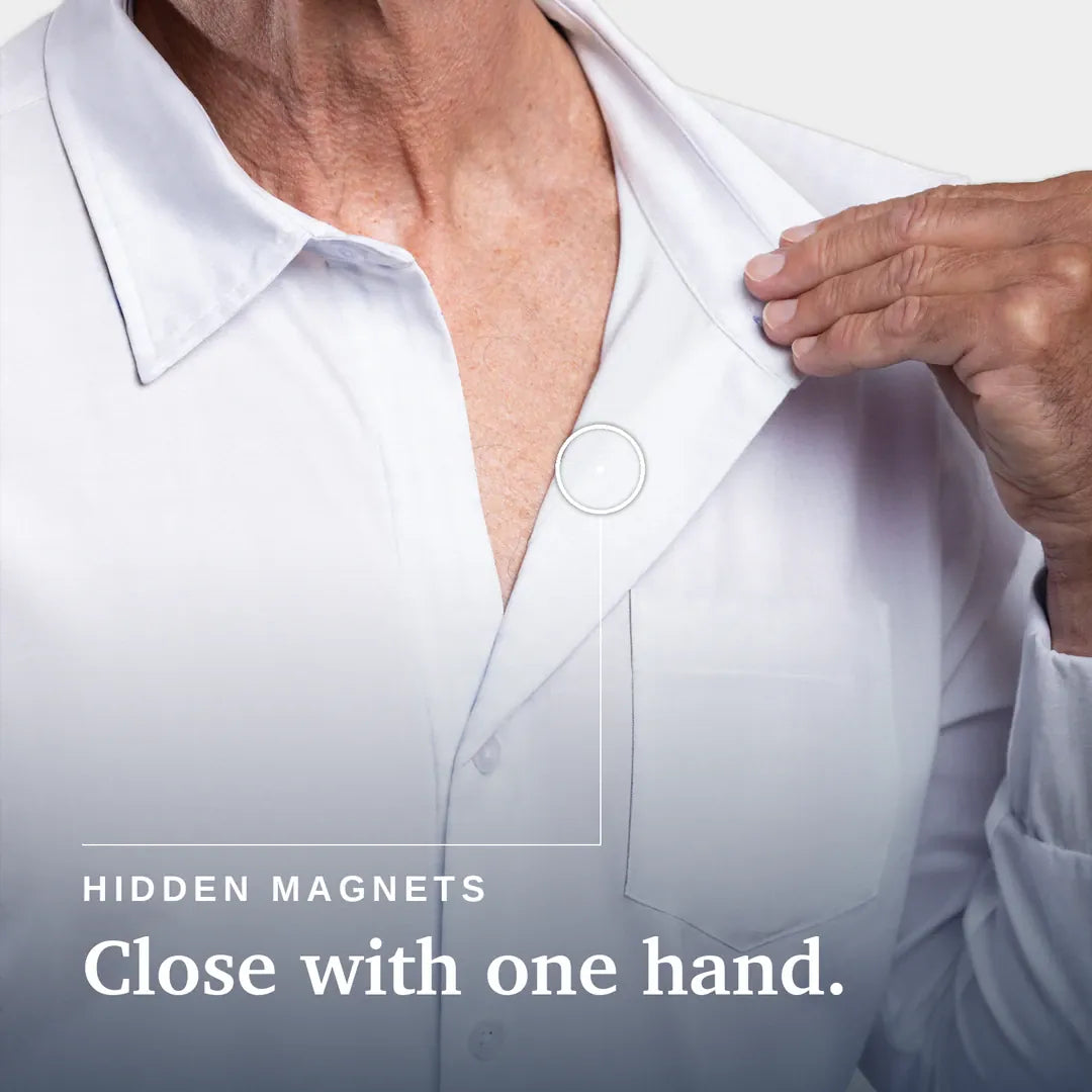 ["Close-up of a person wearing a white button-up shirt, with one hand pulling the collar slightly open. Text on the image reads 'HIDDEN MAGNETS Close with one hand. Joe & Bella Magnetic Button-Down for Men | Relaxed-Fit ", "White"]