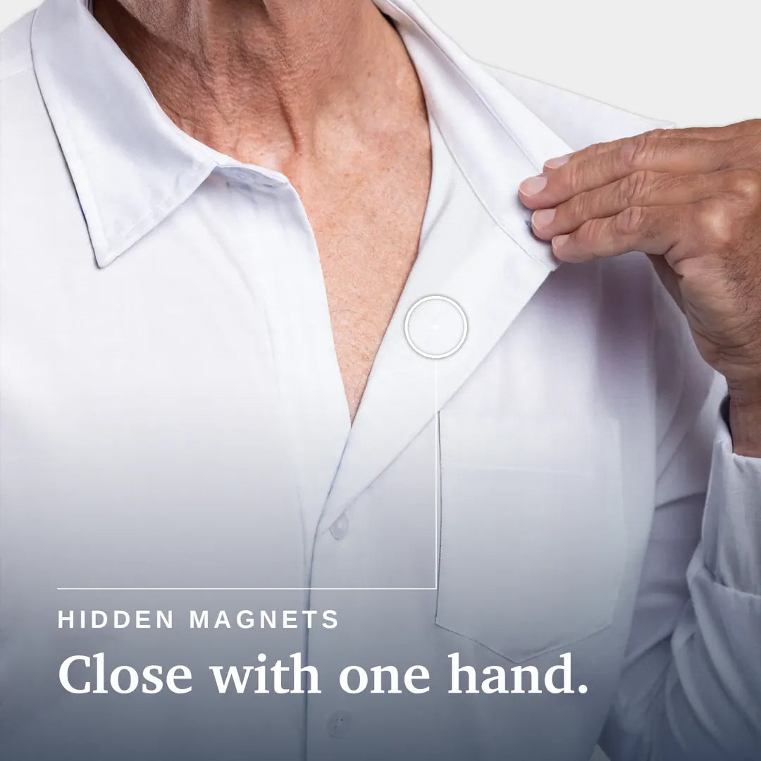 ["Close-up of a person wearing a white button-up shirt, with one hand pulling the collar slightly open. Text on the image reads 'HIDDEN MAGNETS Close with one hand. Joe & Bella Magnetic Button-Down for Men | Relaxed-Fit ", "White"]