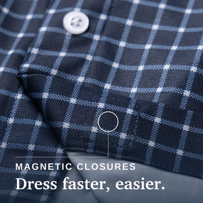 Close-up of a navy and light blue plaid shirt fabric with a white button and text reading 'MAGNETIC CLOSURES Dress faster, easier.'. Joe & Bella Everyday Magnetic Button-Down for Men | Relaxed-Fit #Navy Check