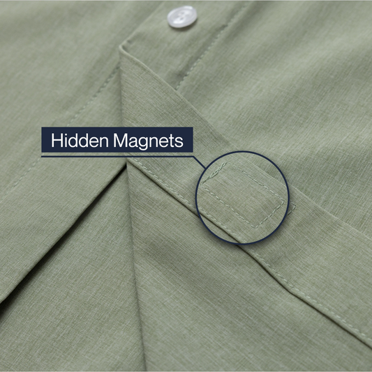 Close-up of a green shirt with a button and text indicating 'Hidden Magnets'. #Green