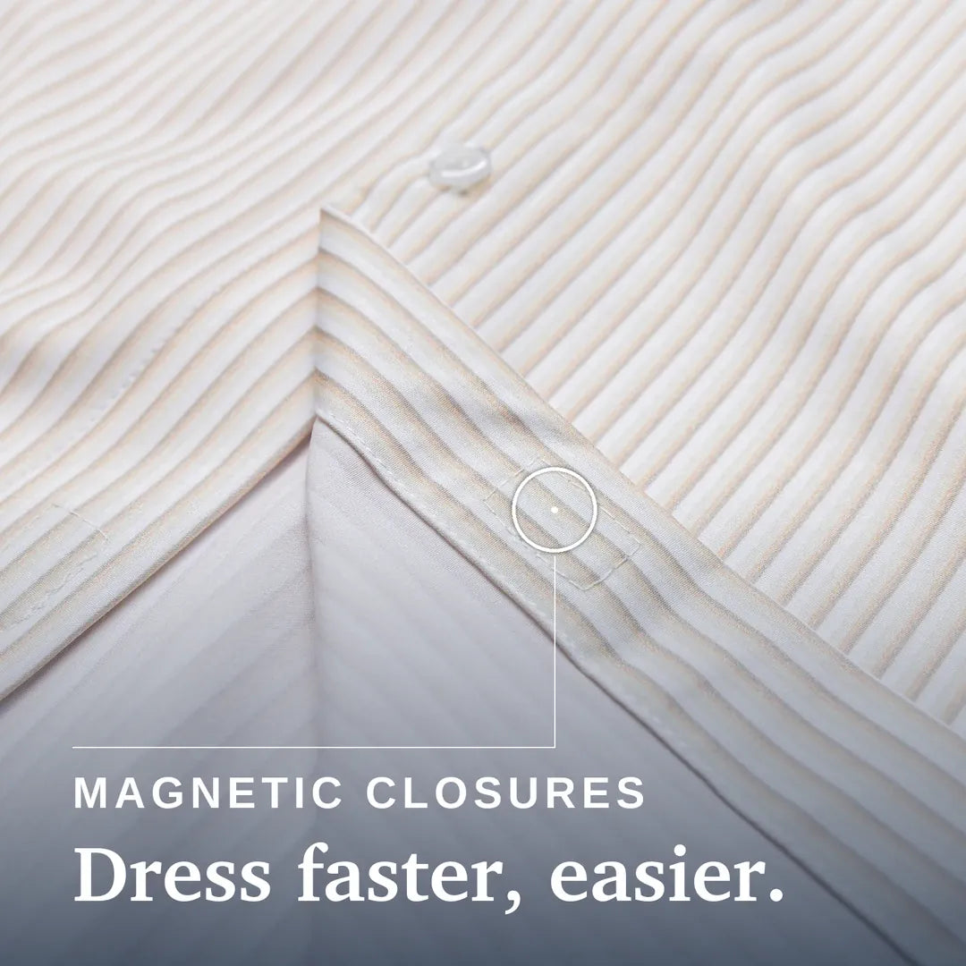 Close-up of a striped bedding fabric corner with a circular callout pointing to a magnetic closure, plus the text 'MAGNETIC CLOSURES Dress faster, easier.' #Tan Stripe