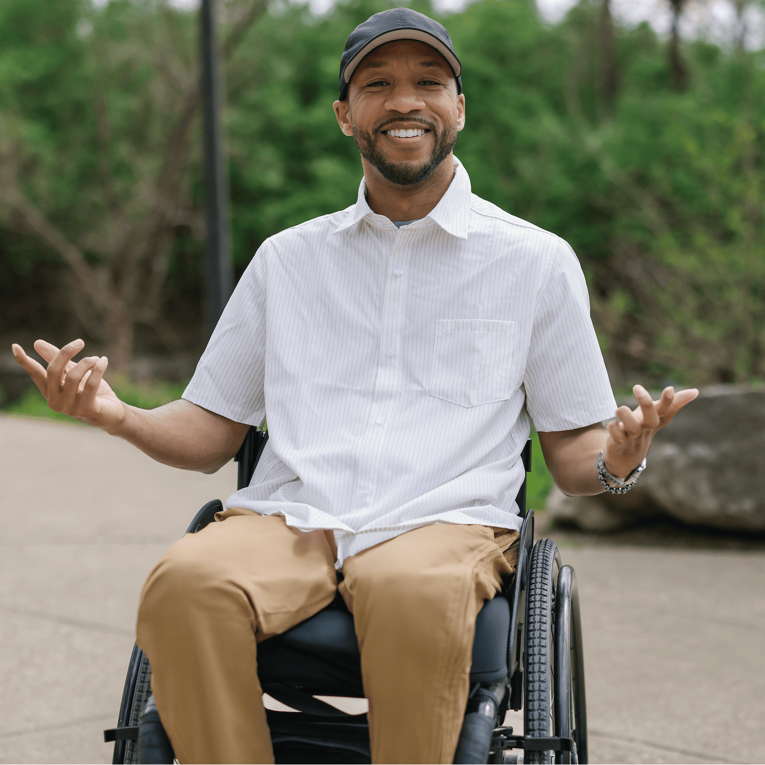 ["Man in a wheelchair sitting outdoors with nature in the background ", "Khaki"]