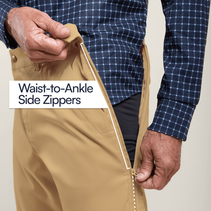 Person zipping a beige pant with waist-to-ankle side zippers, wearing a blue plaid shirt. #Khaki