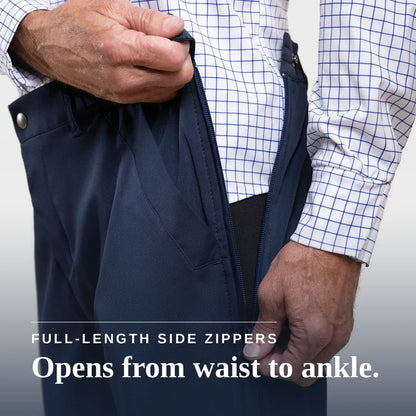Close-up of a person wearing dark navy pants and a white dress shirt with a blue grid pattern, demonstrating a full-length side zipper that opens from the waist to the ankle. Text overlay reads 'FULL-LENGTH SIDE ZIPPERS Opens from waist to ankle. #Navy