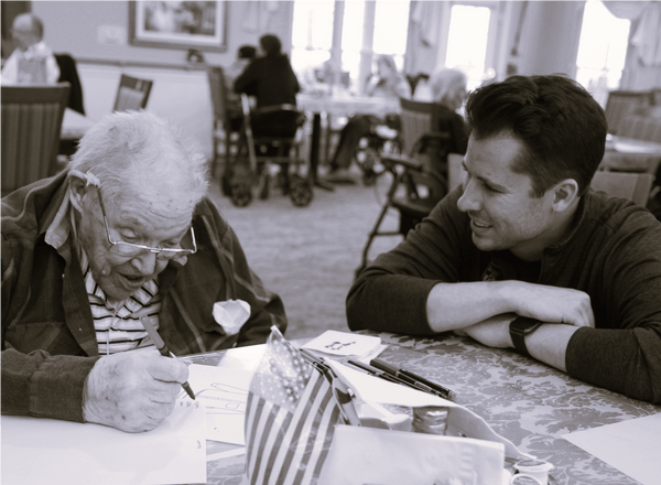 Jimmy Zollo from Joe & Bella sitting with a customer, who is designing a new product.